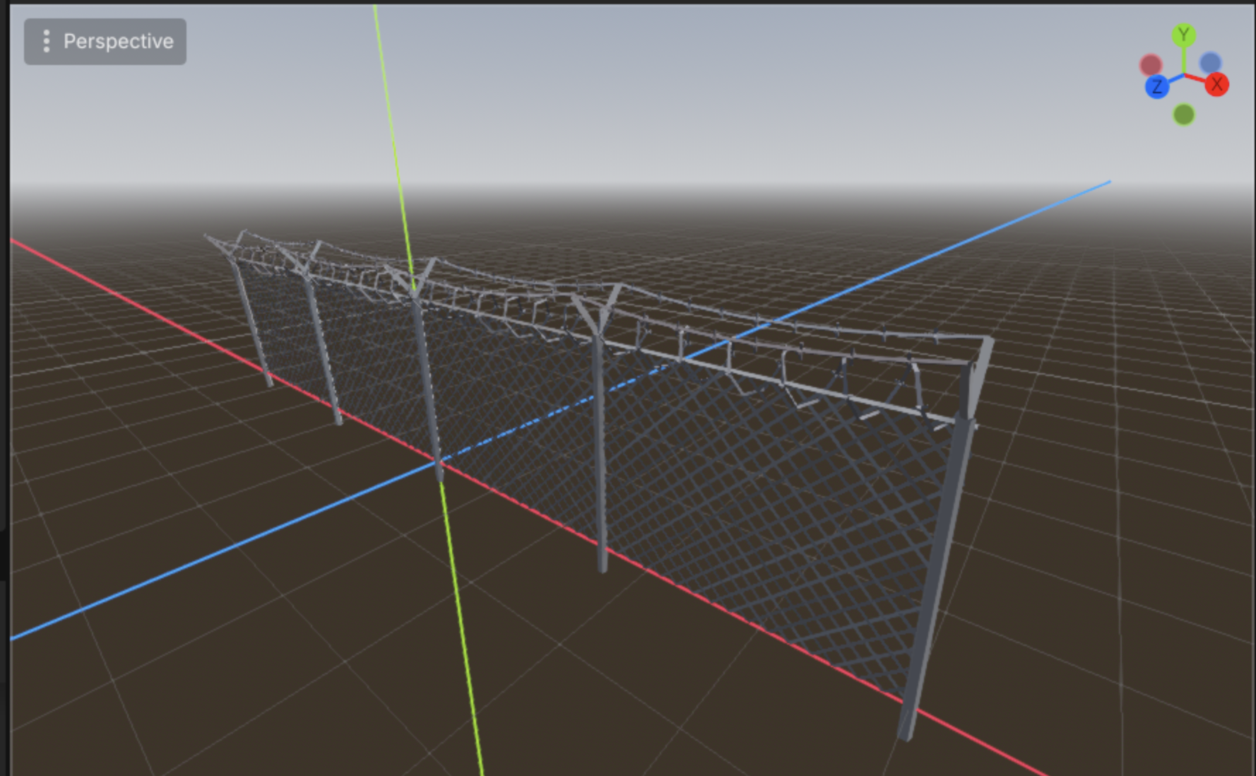A chain-link fence panel with concertina barbed wire along the top, modelled in the editor