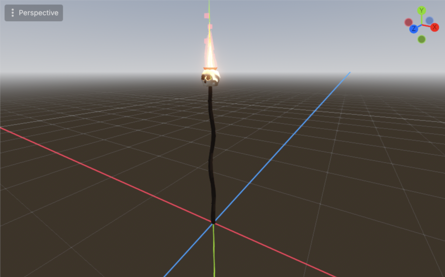A torch with a small skull mounted in the bowl, flame burning above